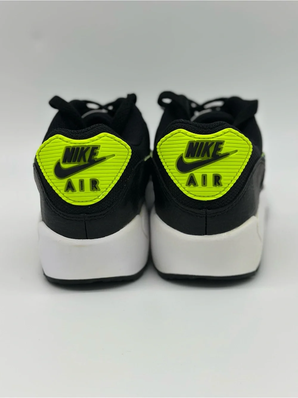 Nike Kids Black Sneakers with Neon Yellow and Blue Swoosh